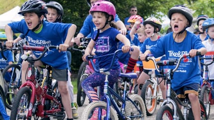 Kids on bikes at Cleveland Clinic Giving event